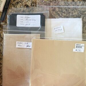 Assorted Fabric Swatches in Black, White, and Beige